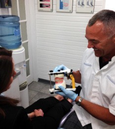 Adrian Haigh holding dentures